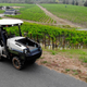 A photo of a Monarch Tractor overlooking a vineyard.